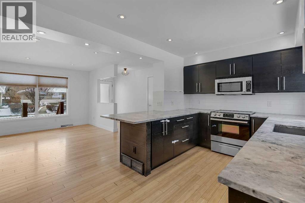 Single Family House Bungalow for Sale in  Langton Drive SW North Glenmore Park Calgary 