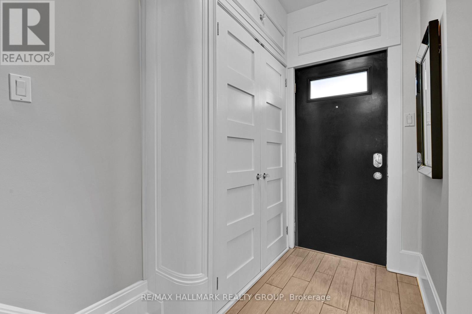 Front hall w doubles closet and curved wall detail