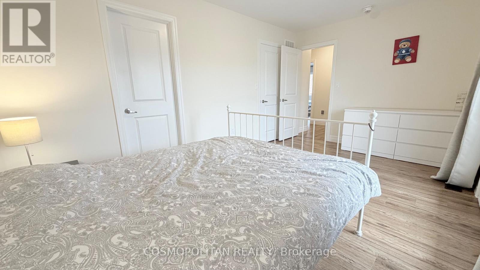 second  bedroom with a walk in closet/bathroom