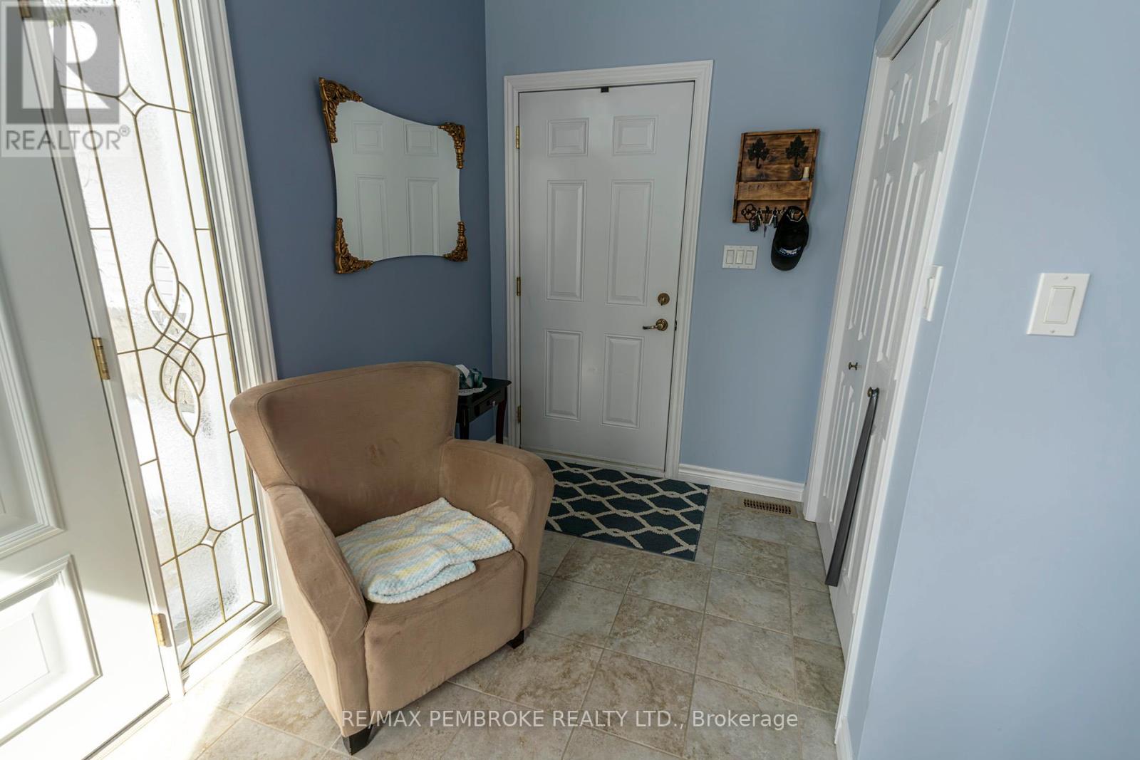 front foyer entry to attached garage