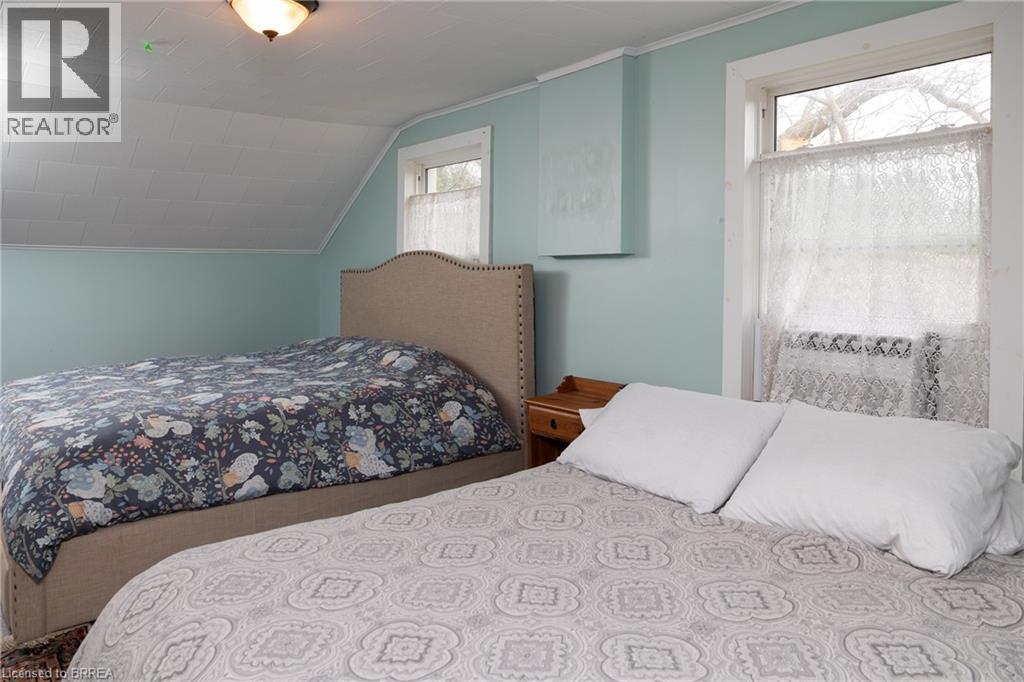 Bedroom featuring lofted ceiling