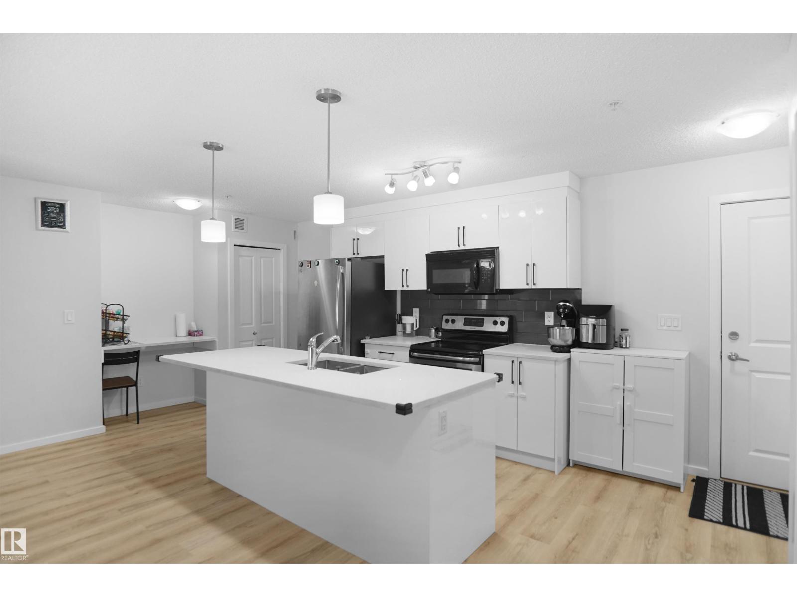 #103 3353 16A AV NW - 5