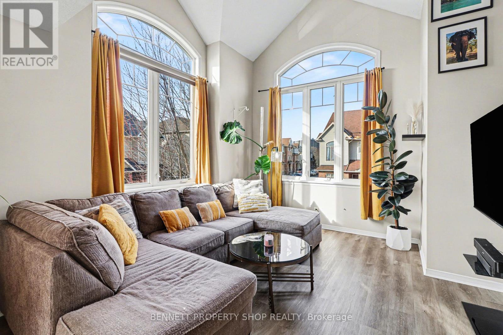 Windows soar on all 3 sides of this end unit