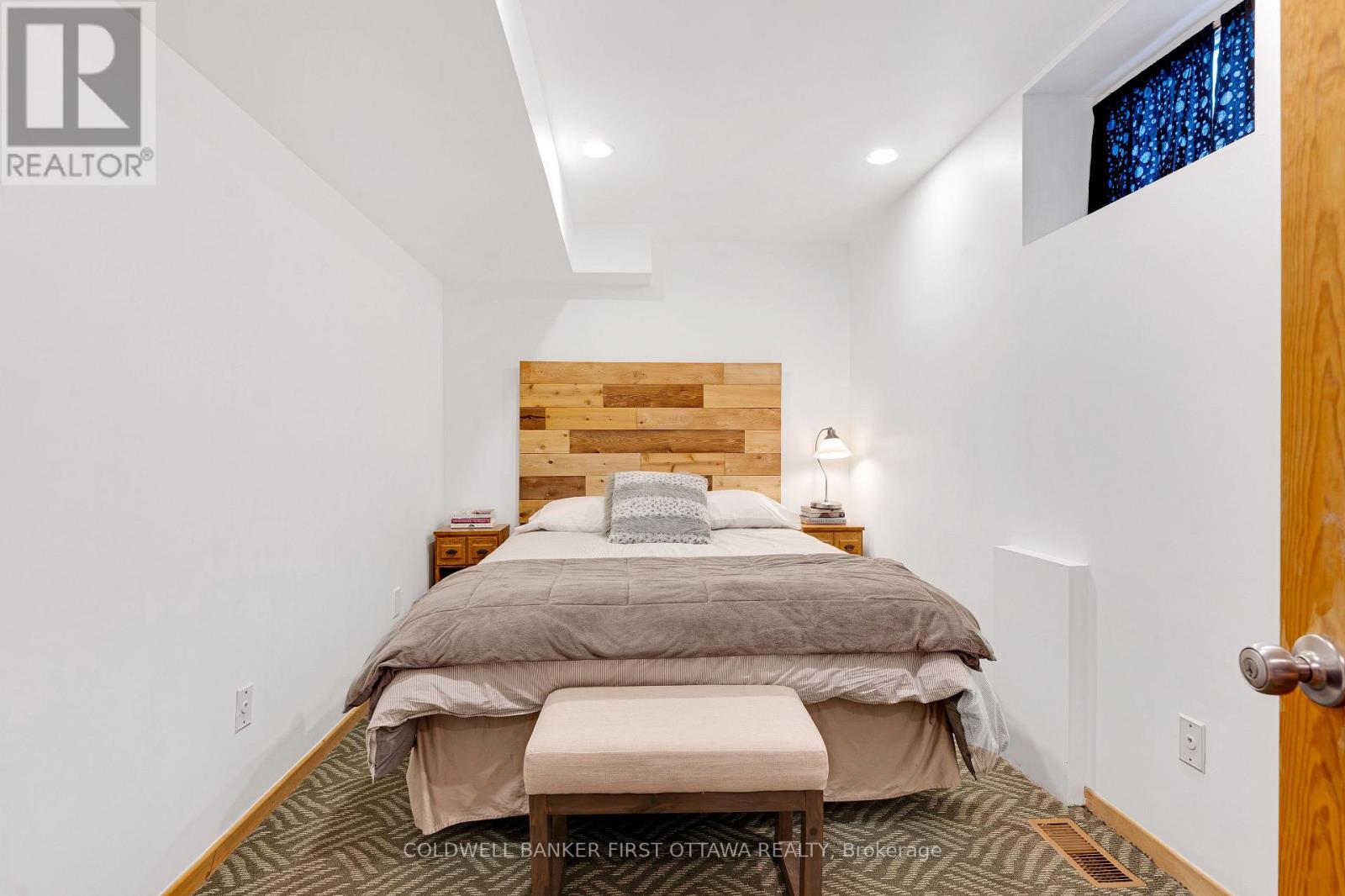 Lower level den currently set up as bedroom