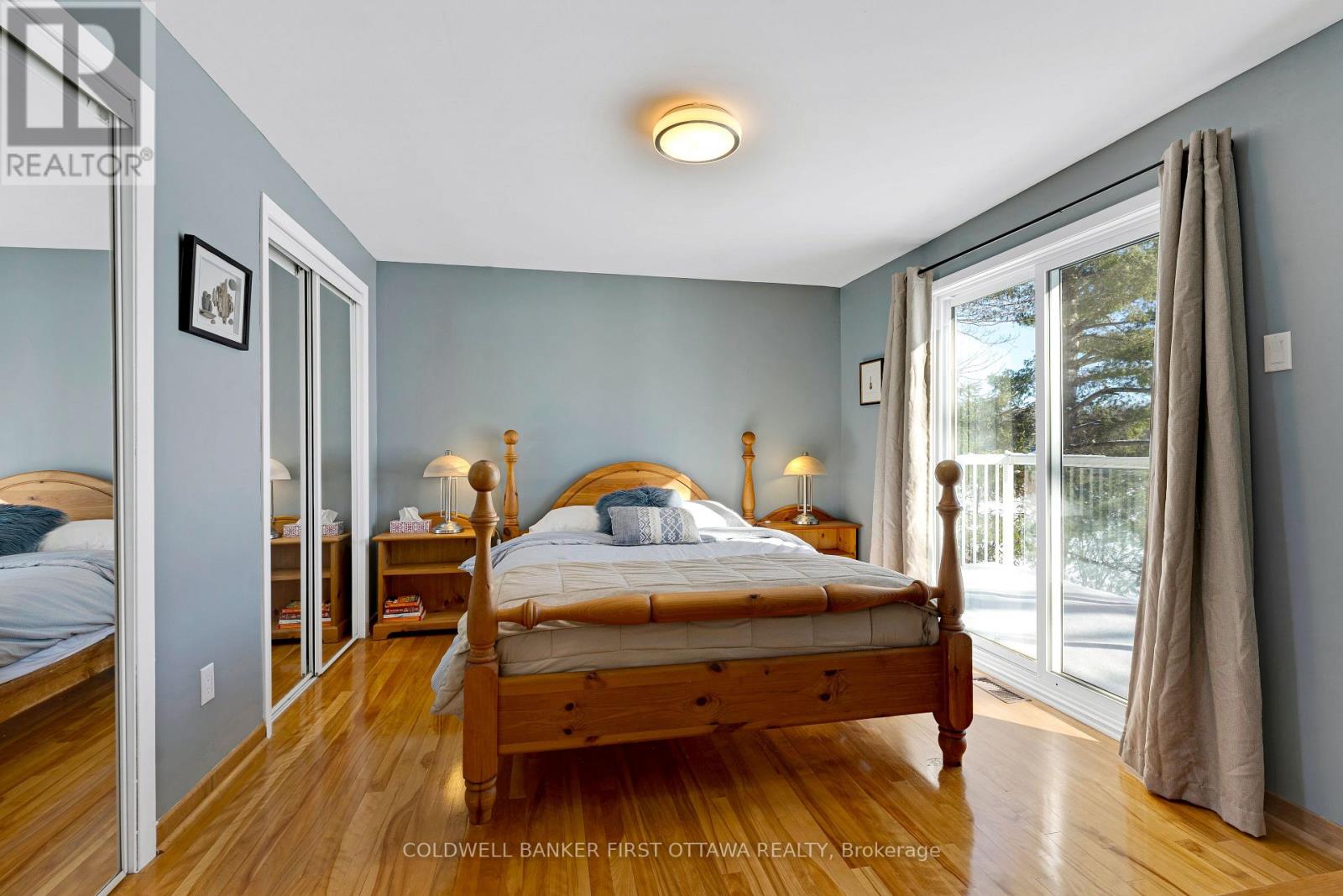 Lower level, home's 5th bedroom - with balcony
