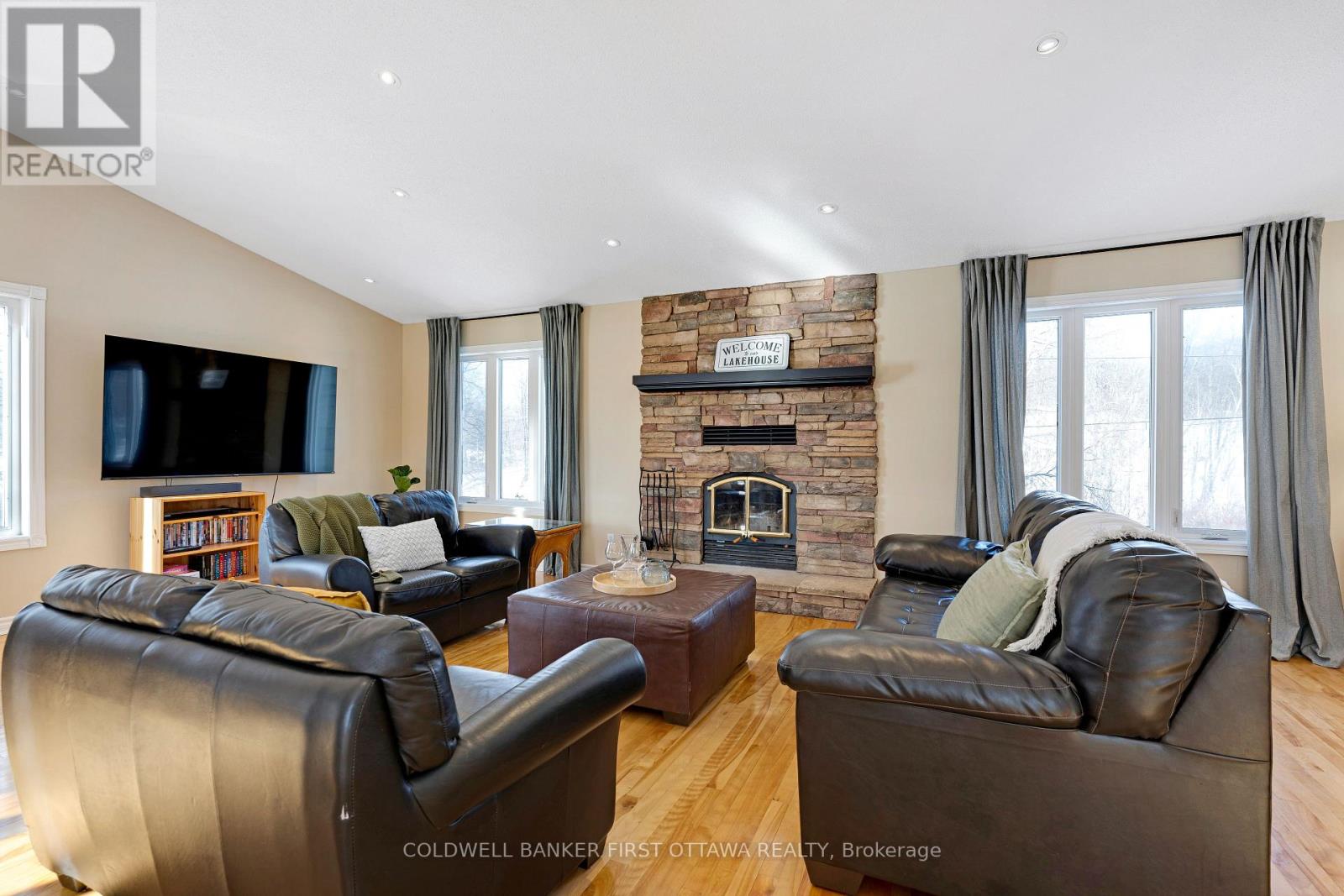 Stone fireplace with efficient wood-burning insert