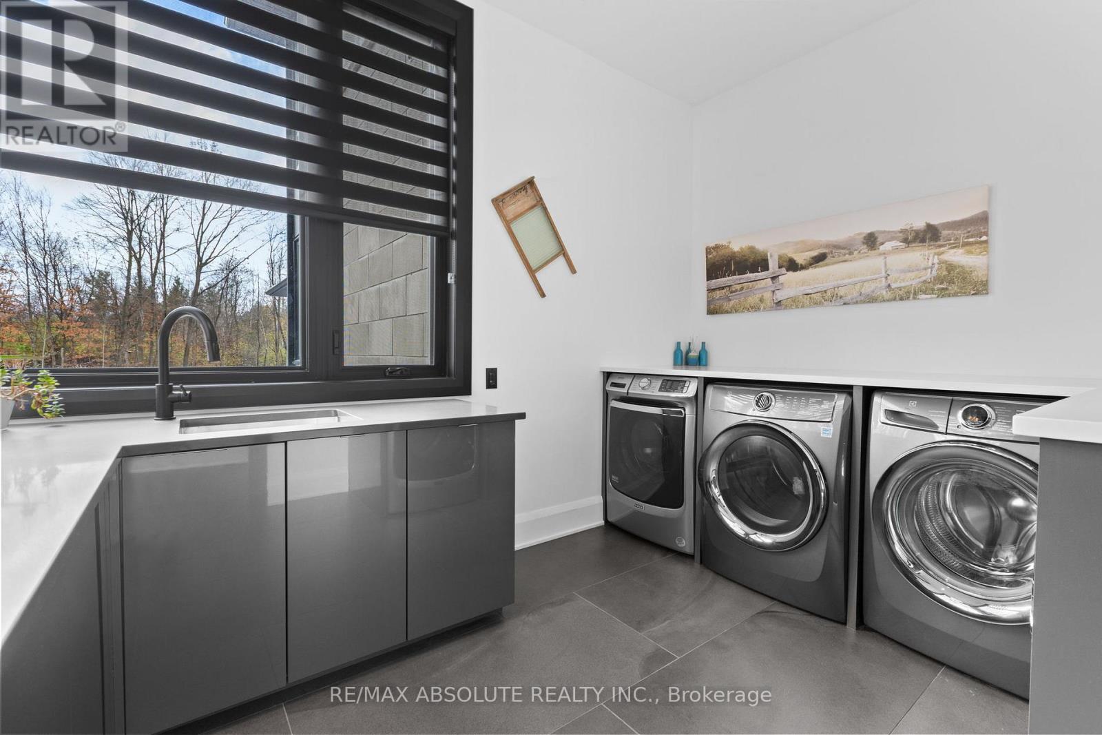 Laundry room offers 2 washer & 2 dryers