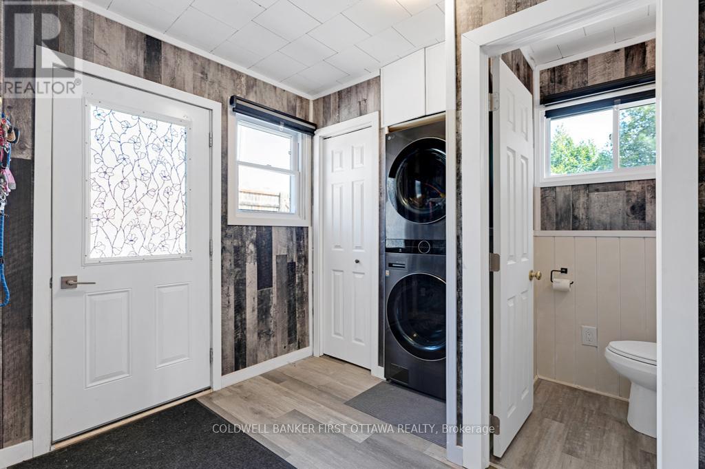 Foyer has closet, laundry station and powder room