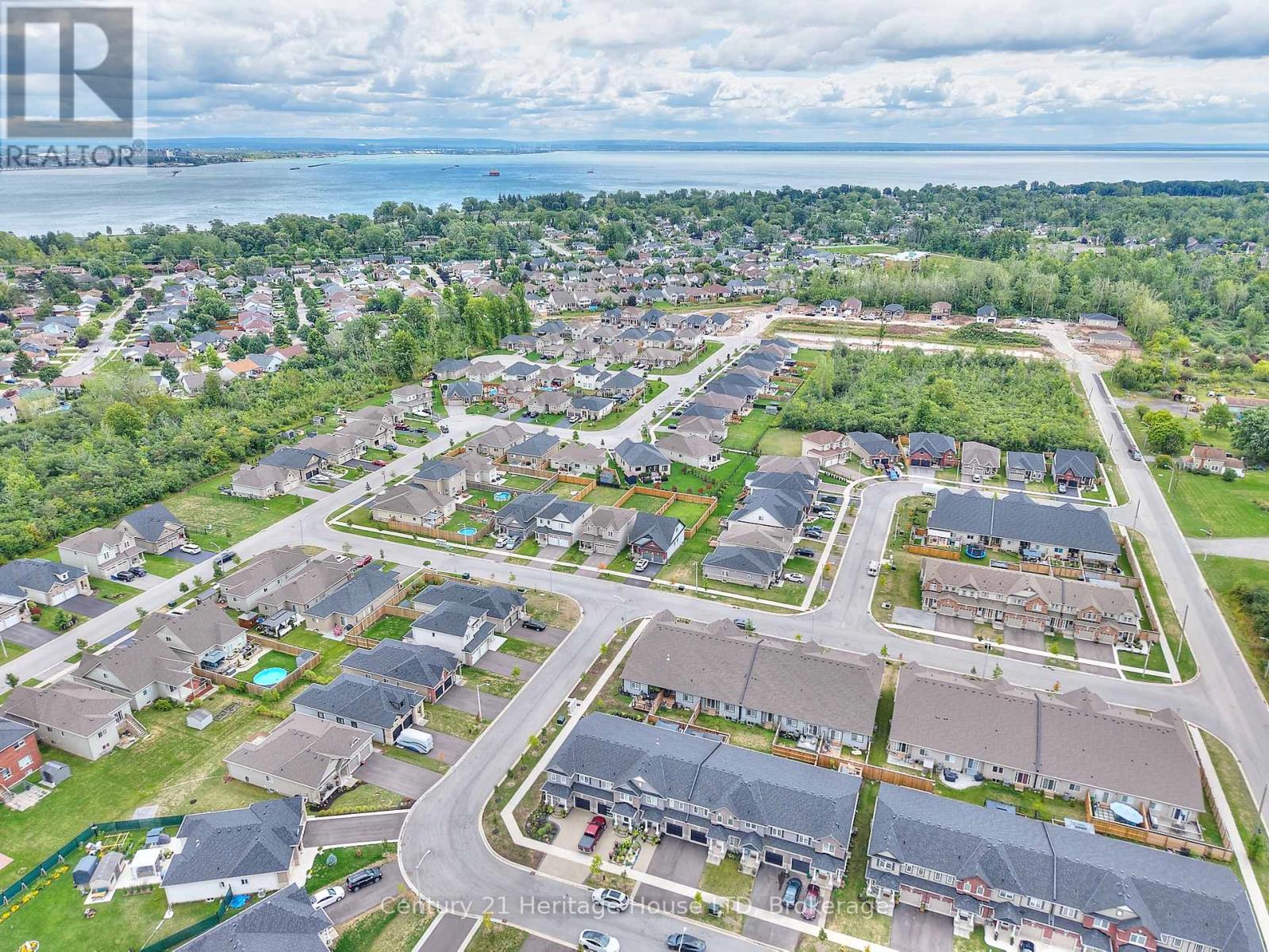 Aerial view of the property and surrounding area