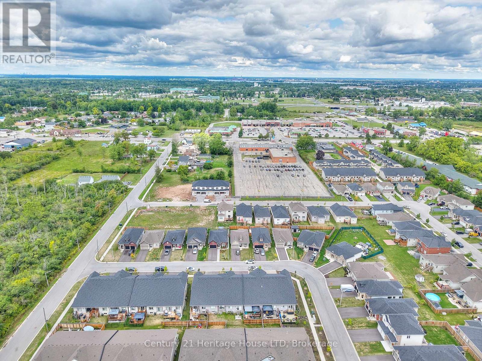 Aerial view of the property and surrounding area