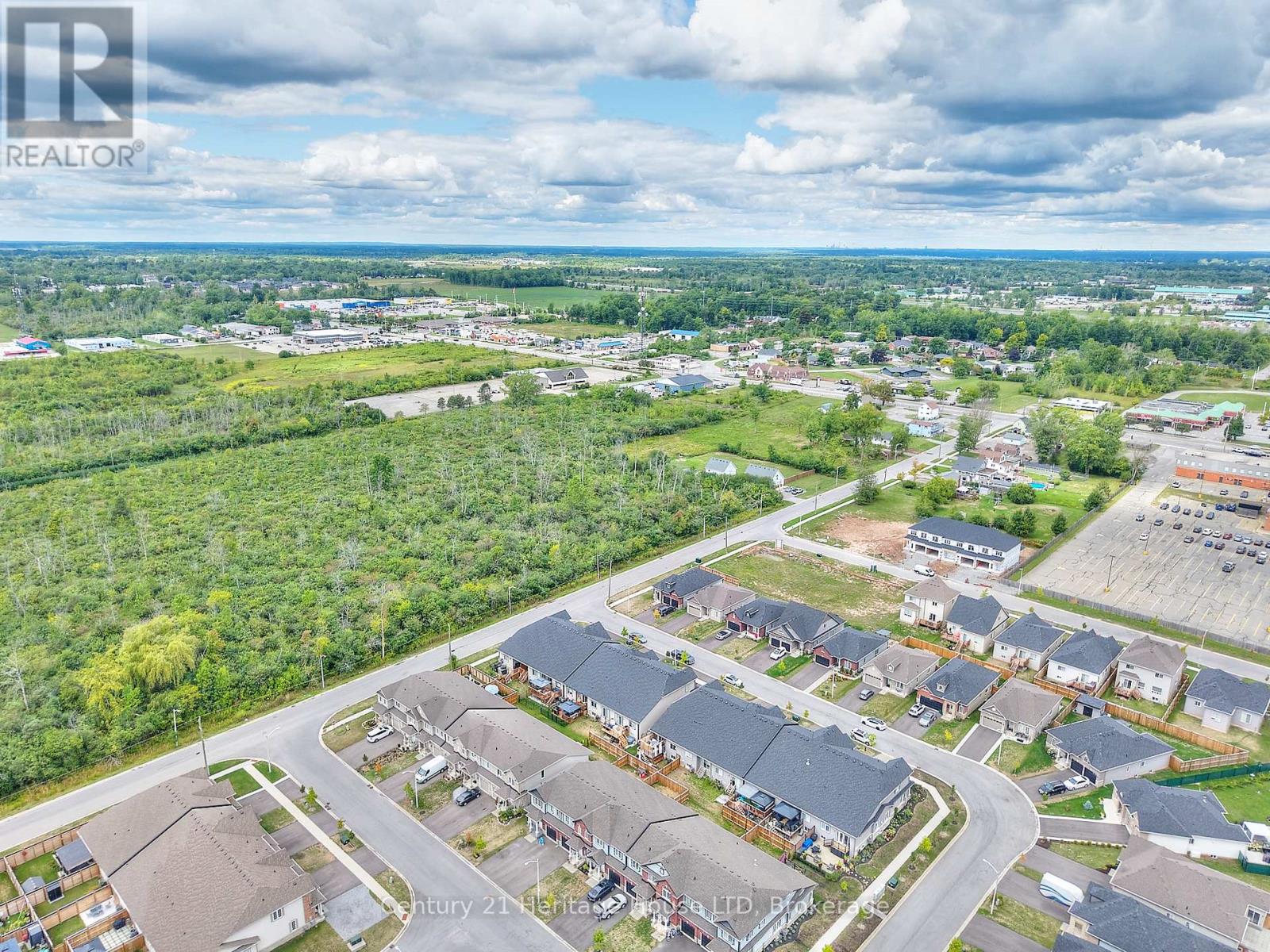 Aerial view of the property and surrounding area