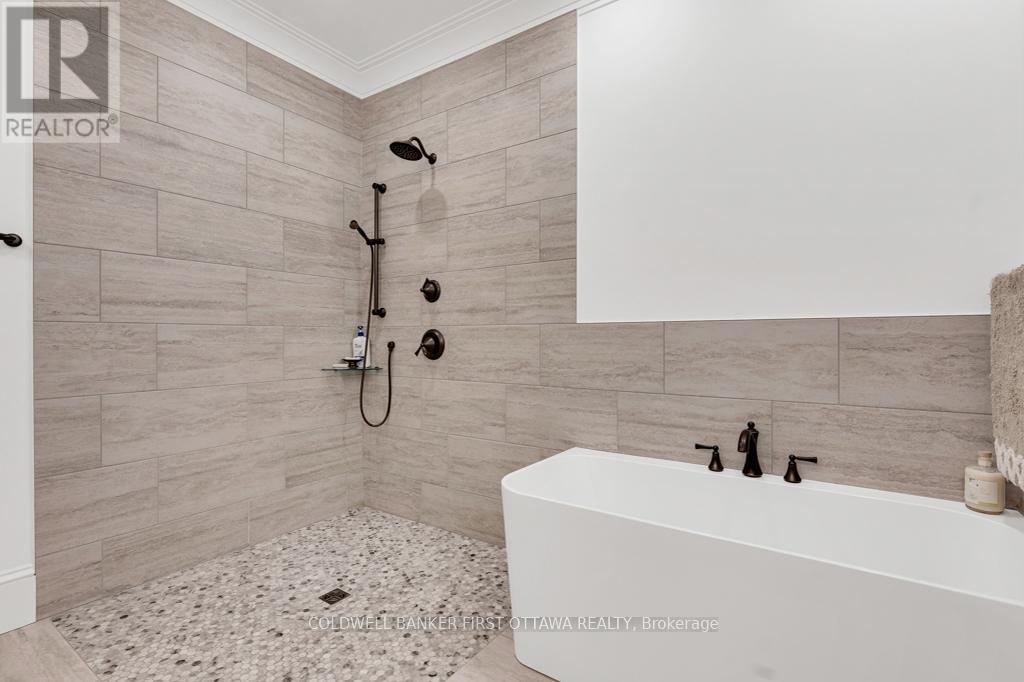 Primary suite'sshower & soaker tube