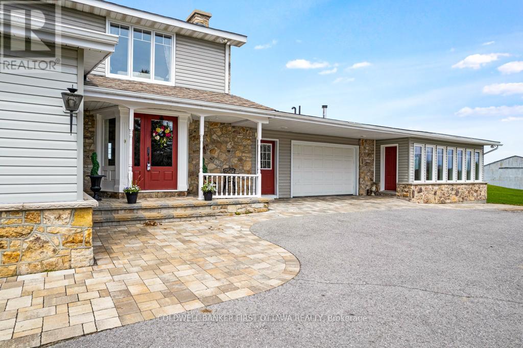 Side entrance with one of two attached garages