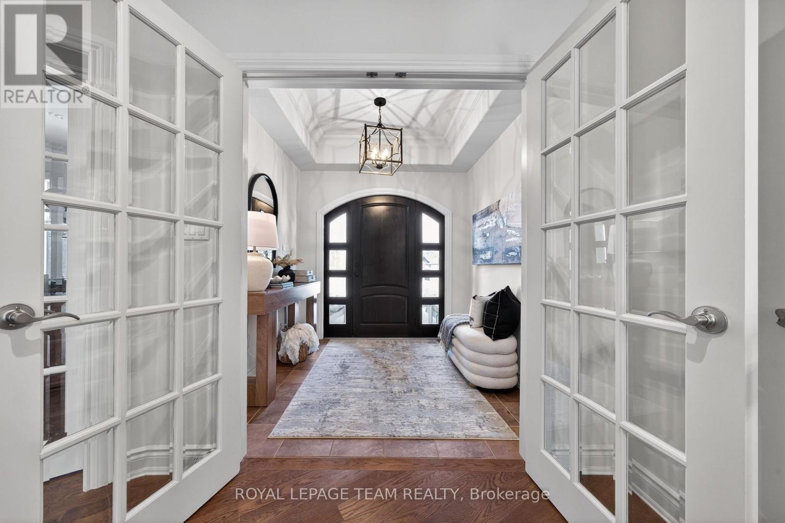 Grand entrance opens to sun filled great room