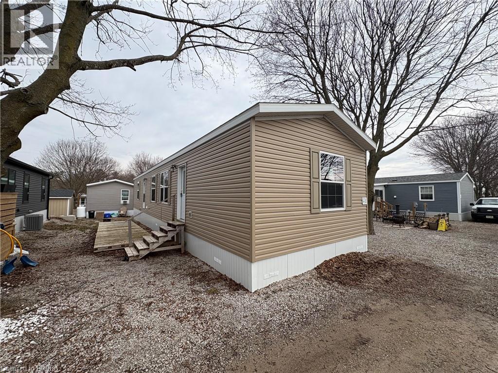 View of property exterior featuring a central AC unit