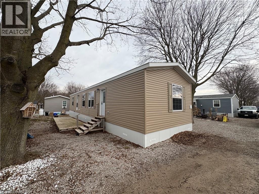 View of side of property with entry steps
