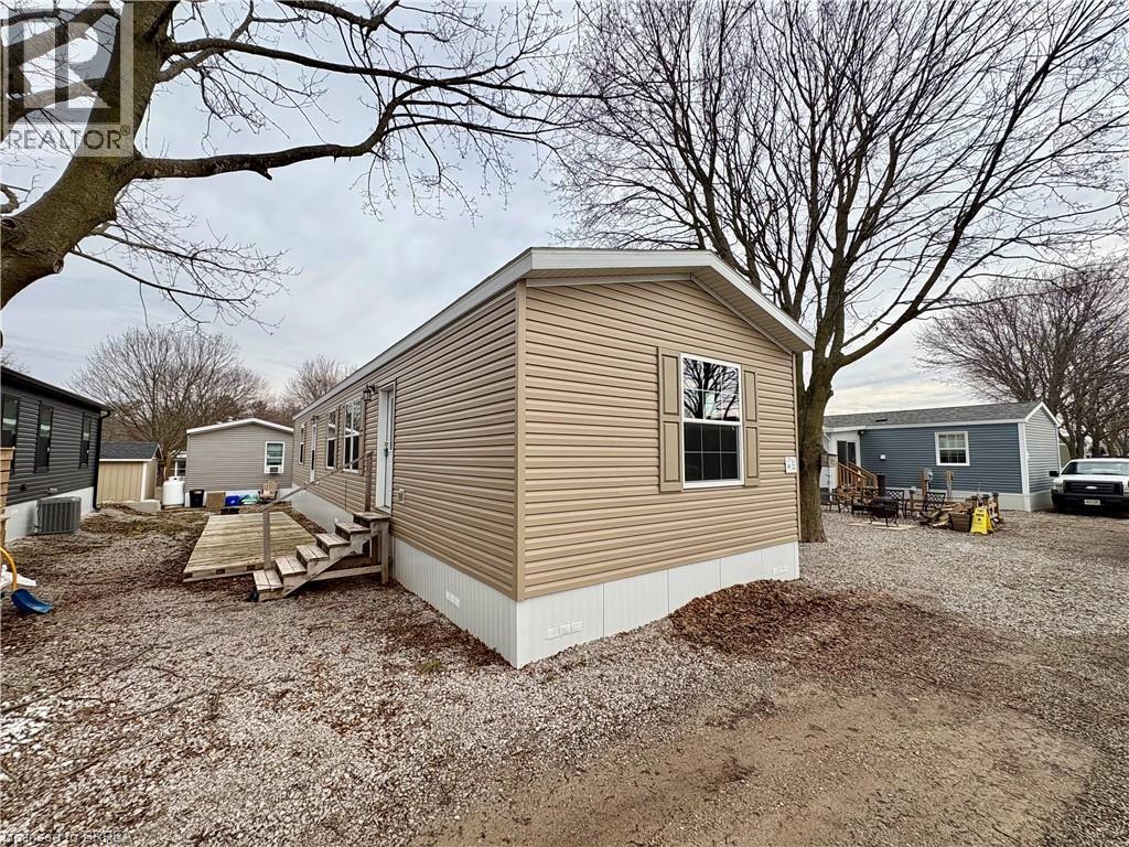 View of property exterior featuring a cooling unit
