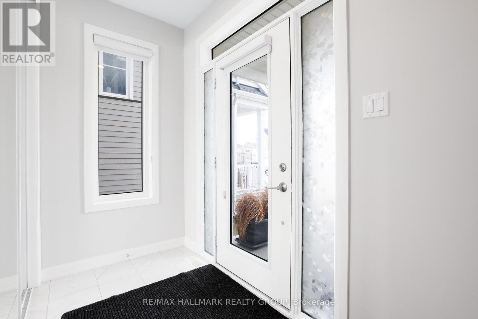 FOYER | abundant natural light, blind on door