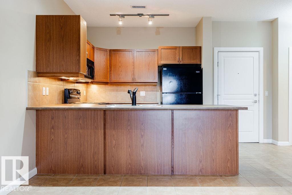 #217 160 MAGRATH RD NW - 6