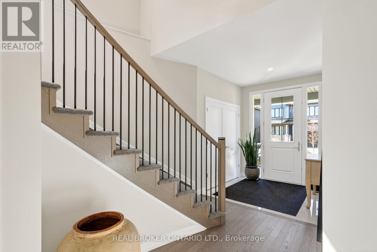 Elegant staircase greets you as you walk in