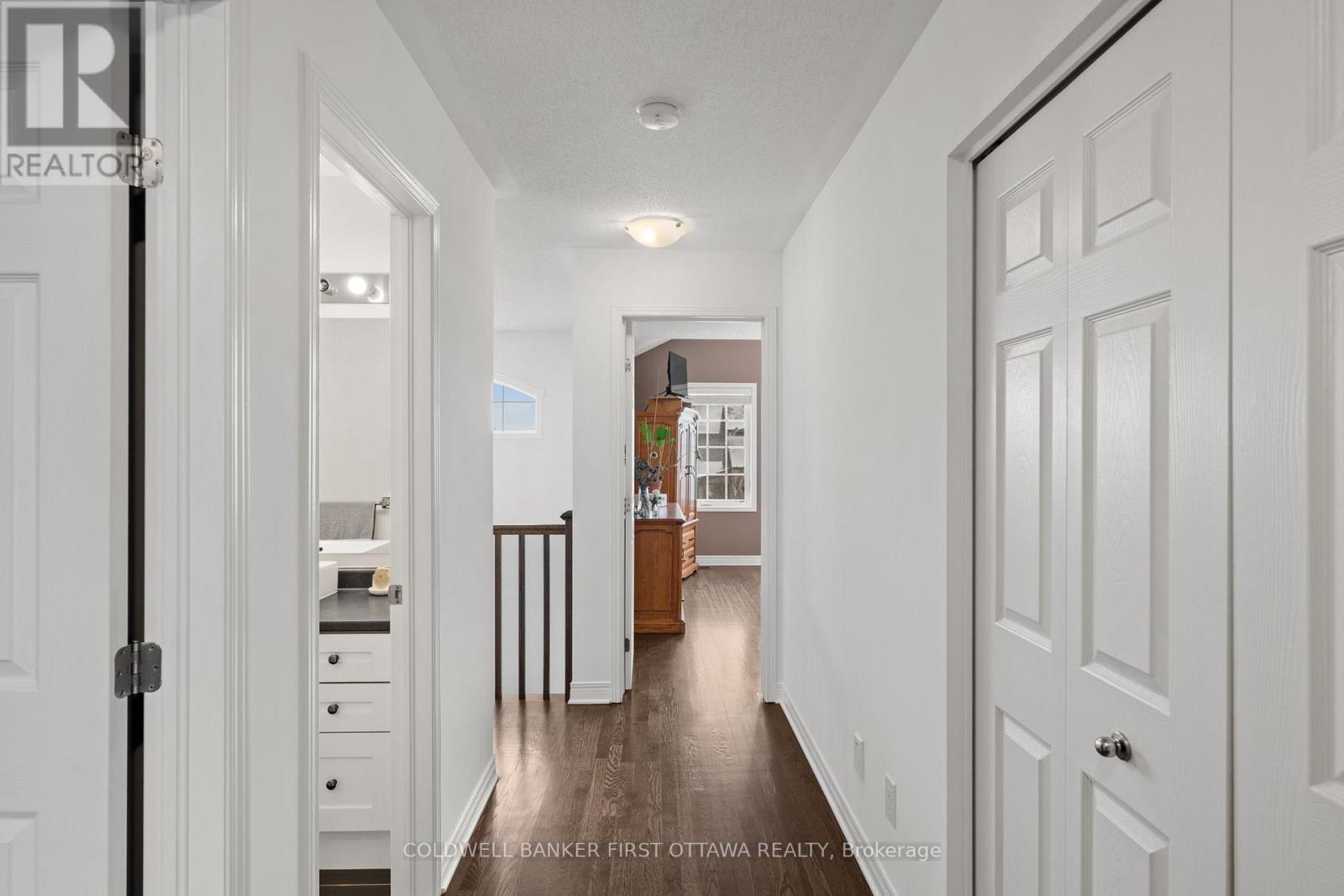 2nd Level hallway w oversized custom linen closet.
