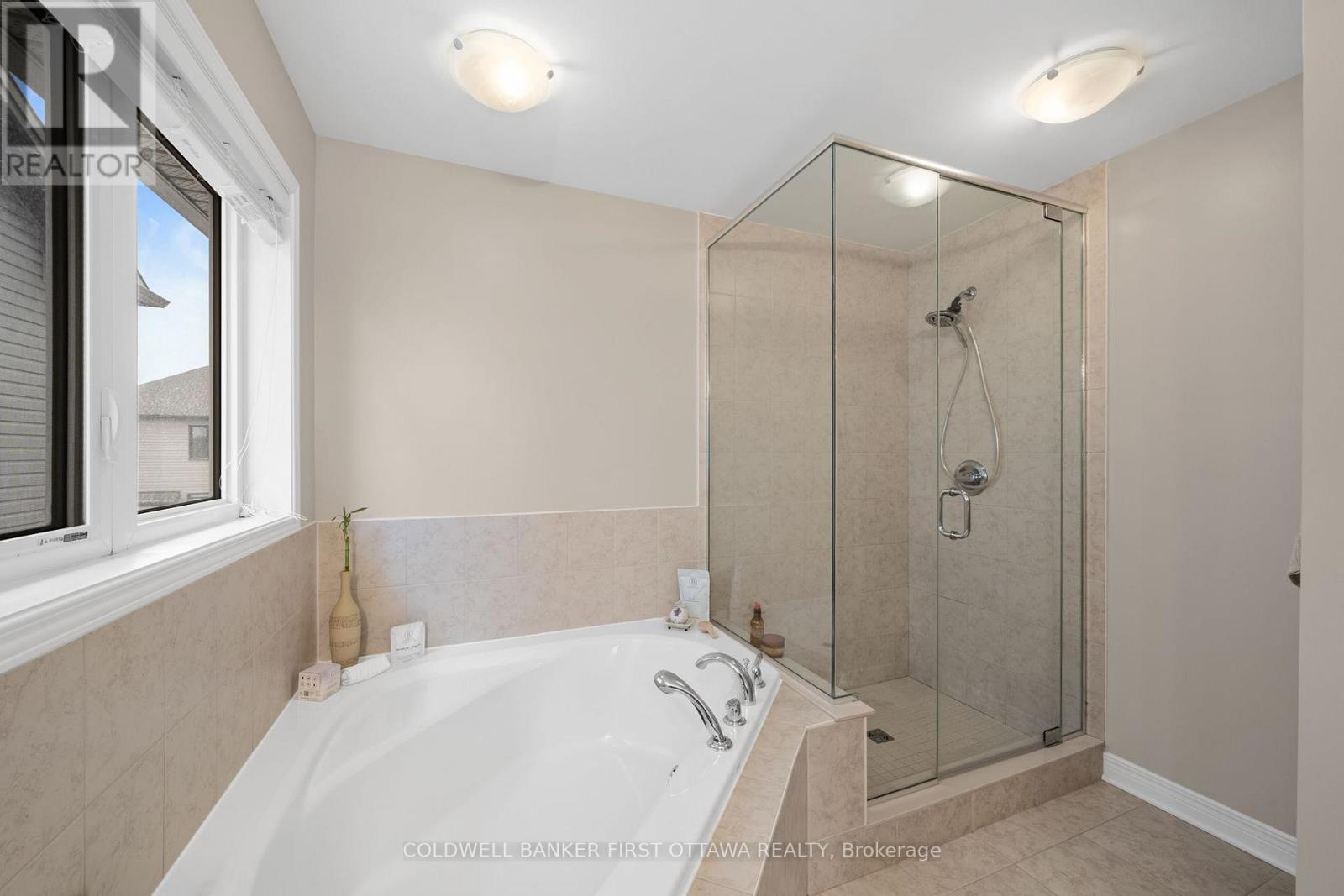 Stand up glass shower & bright window.