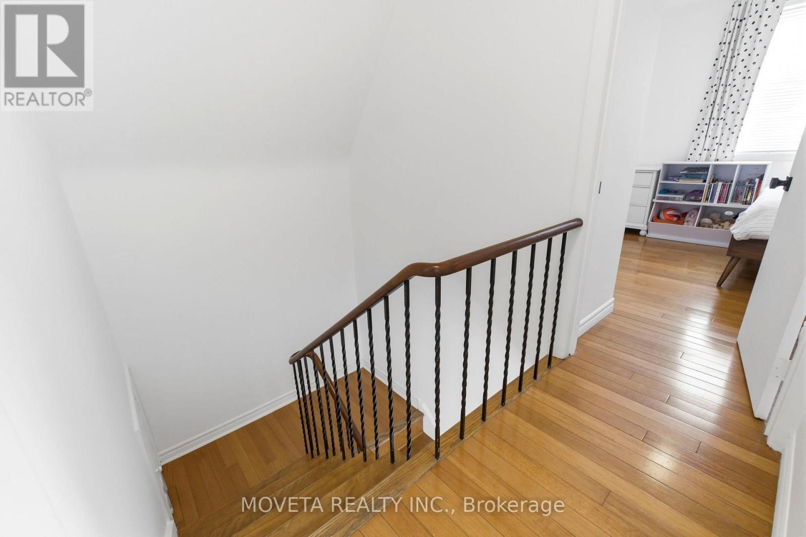 Tasteful stairwell and Hardwood floors