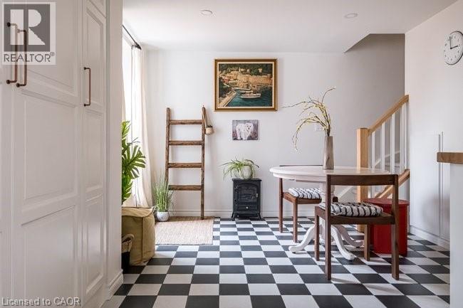 Main Floor: Checkerboard tile (#VINNE & #VINBI), Matte Blanco & Nero, 8” x 8” by Centura Tile: From the kitchen, step out onto a 202 sq. ft. deck with a side yard.