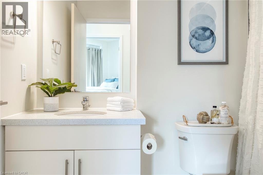 Full bath with vanity and a shower with curtain