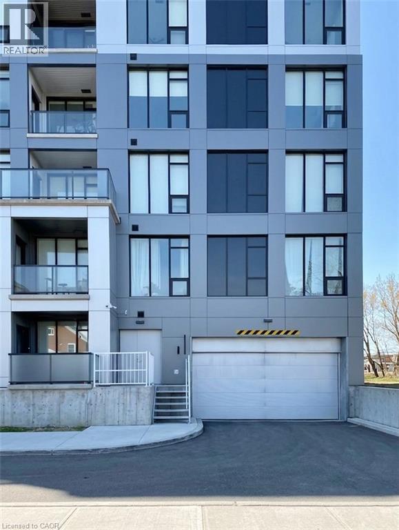 View of apartment building / complex with driveway