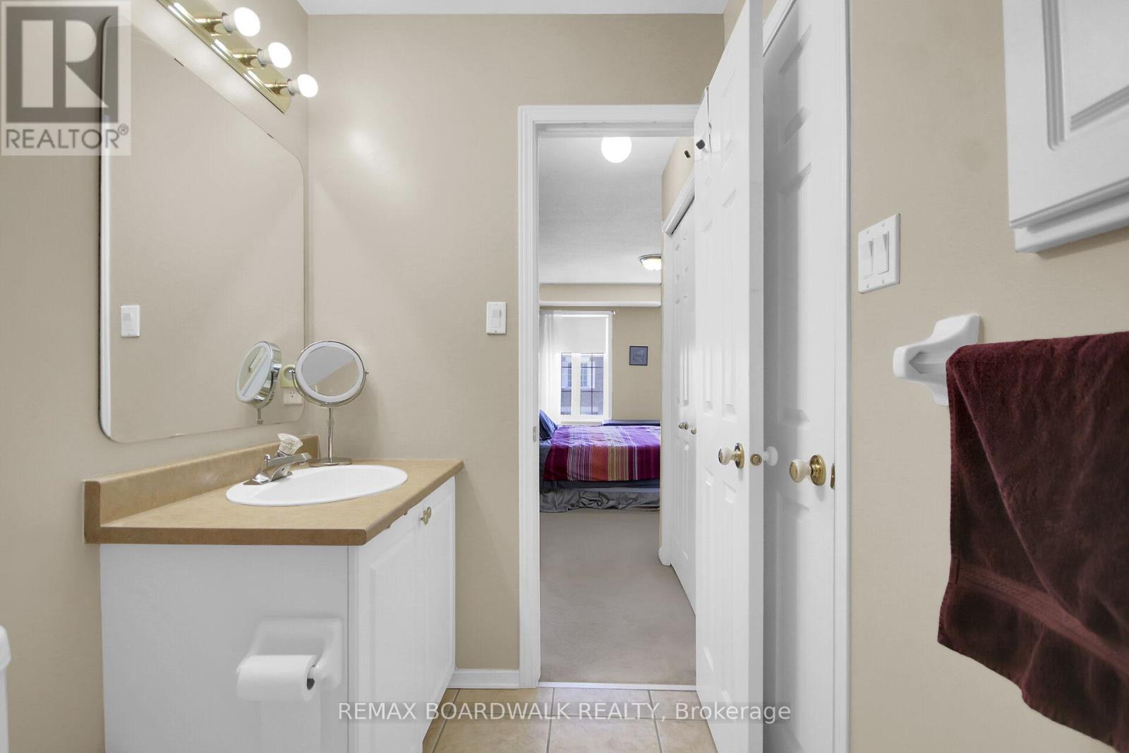 Main bathroom with cheater door to primary