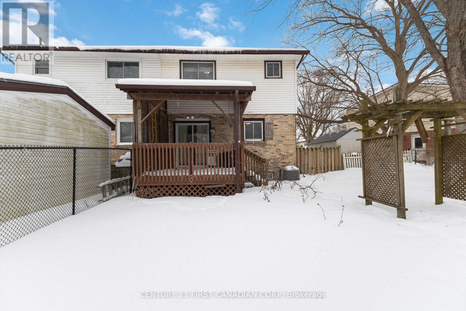 Walk out covered deck from patio doors, in kitchen