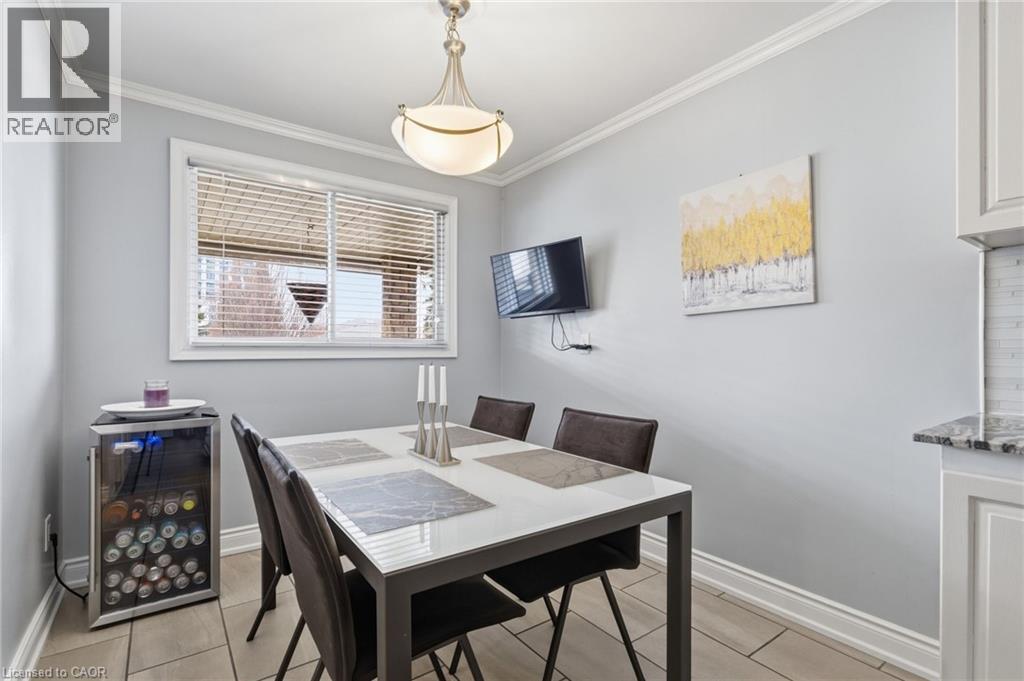 Dining space featuring baseboards and crown molding