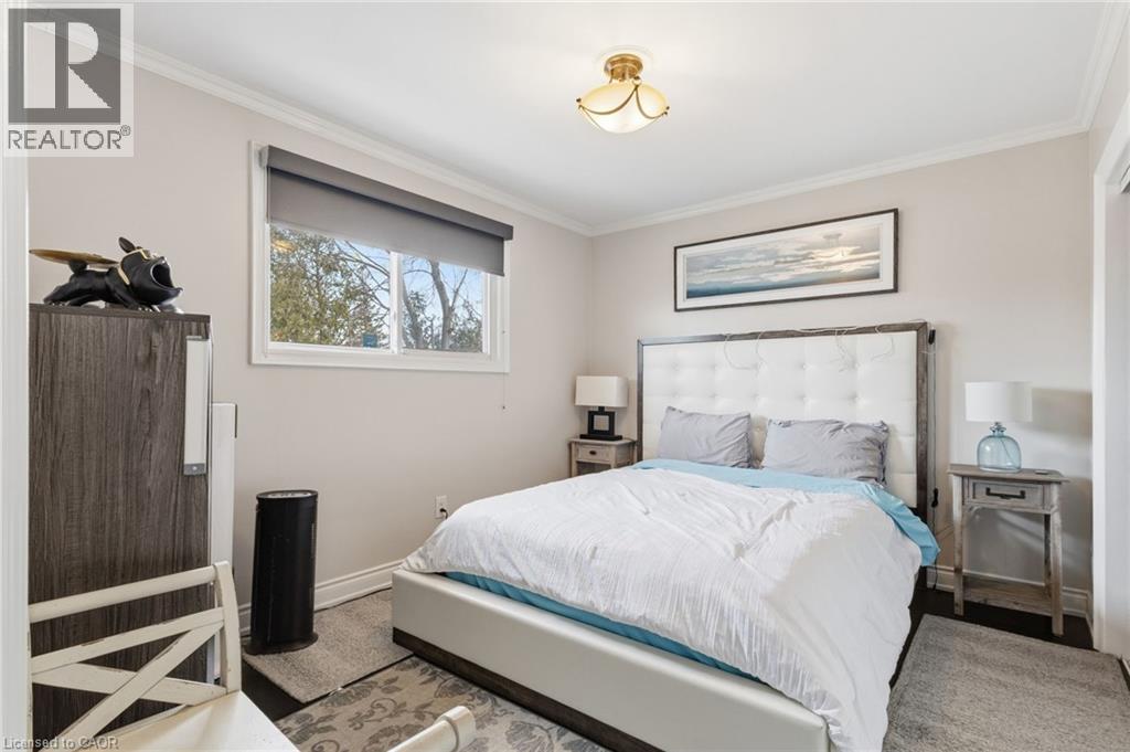 Bedroom with baseboards and crown molding