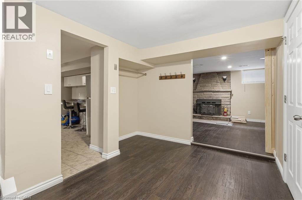 Unfurnished living room with wood-type flooring, a fireplace, and recessed lighting