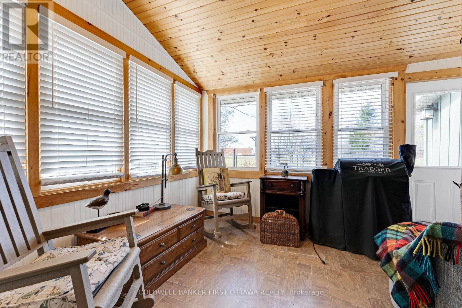Three-season sunroom wrap-about  windows