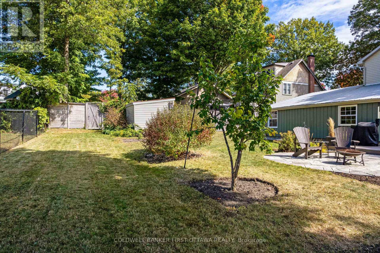 Landscaped yard with trees and gardens