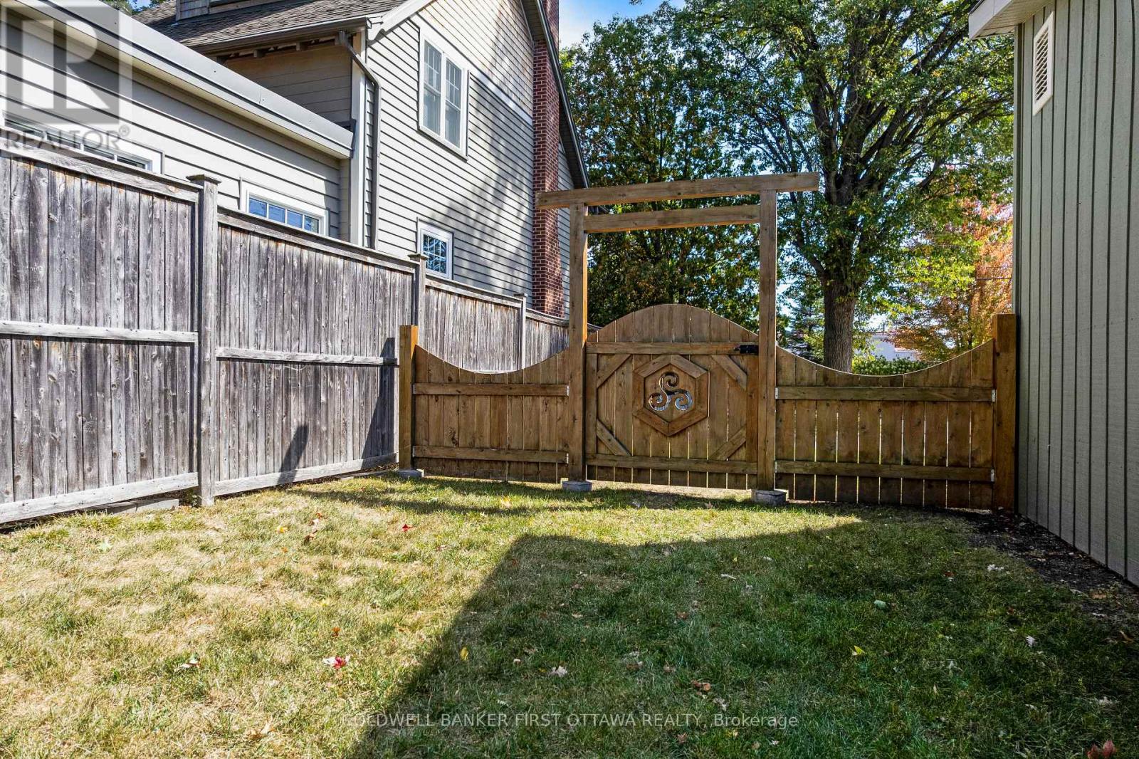 Wonderful decorative gate opens to the backyard