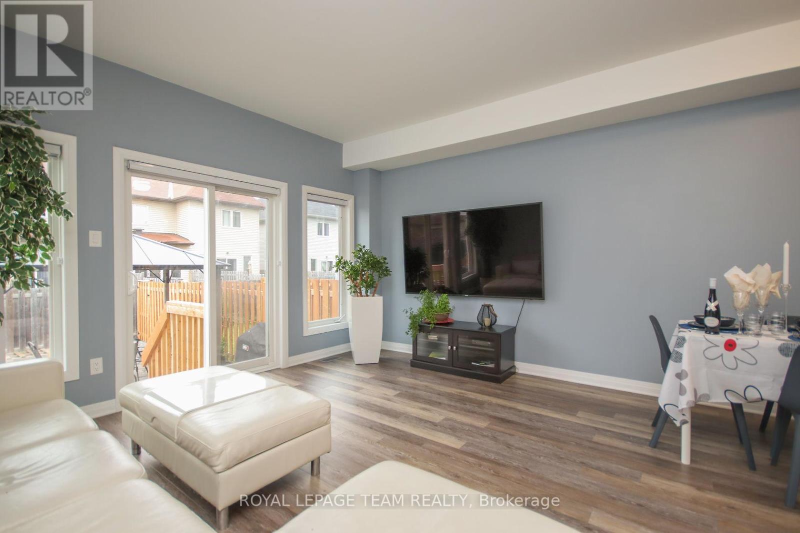 Large windows & patio doors in Living Rm.
