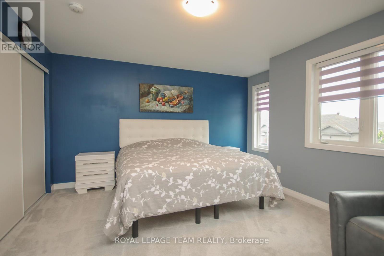Bright Bedroom with large windows.