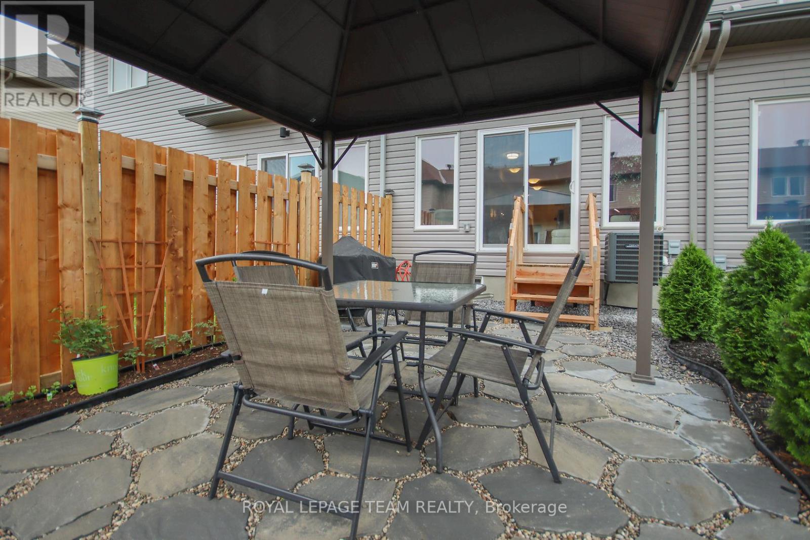 Stone patio with high end pergola.