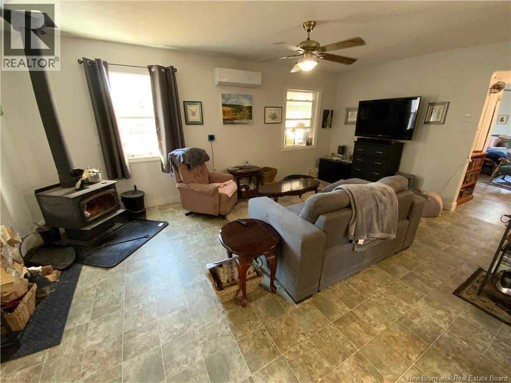 Cozy Living area with Woodstove and mini split heat pump.