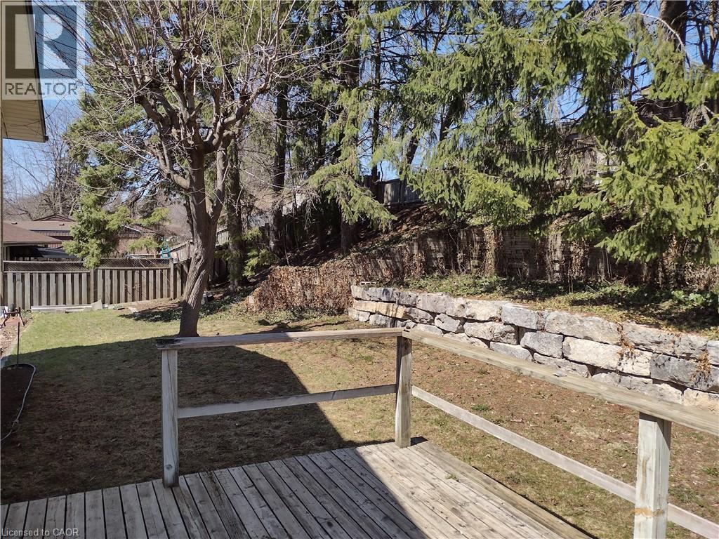 Wooden deck featuring a fenced backyard