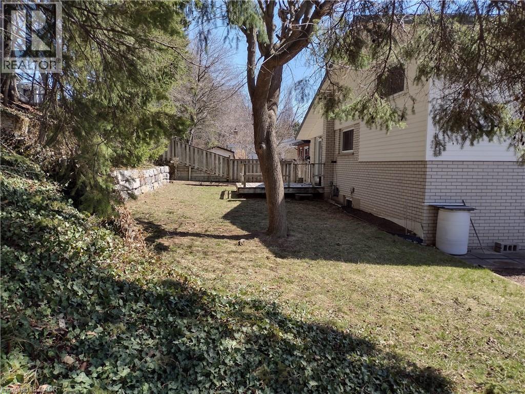 Fenced backyard with a wooden deck