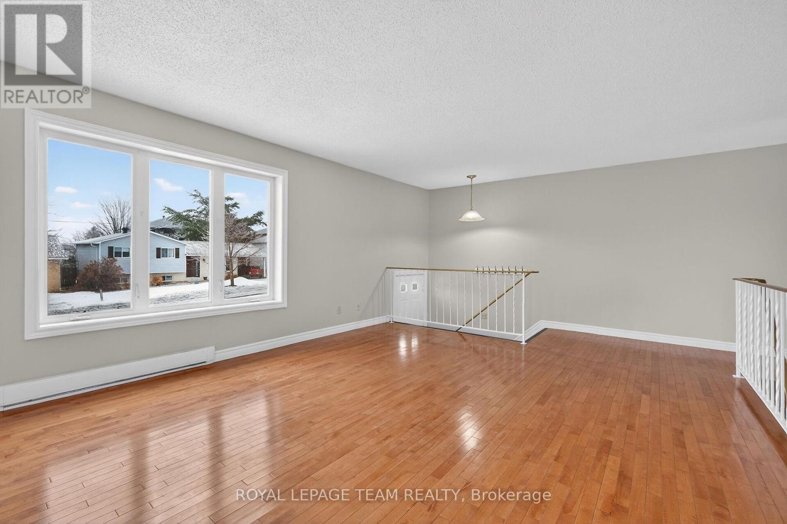 Large window in spacious LR floods area w/light.