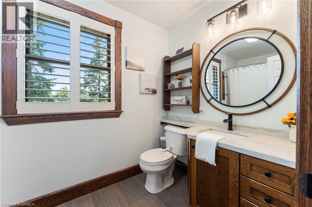 Bathroom featuring vanity and curtained shower