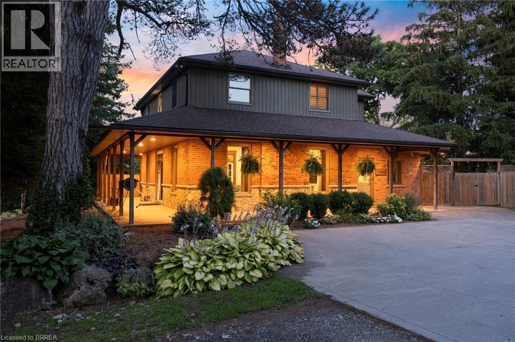 Farmhouse-style home featuring a large porch and a shingled roof