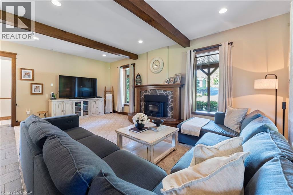 Living area featuring recessed lighting and beam ceiling