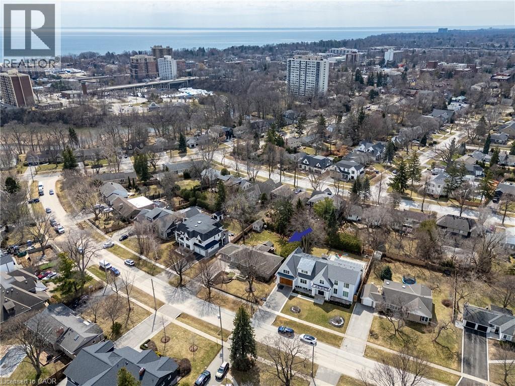 View of property location featuring a nearby body of water and nearby urban area