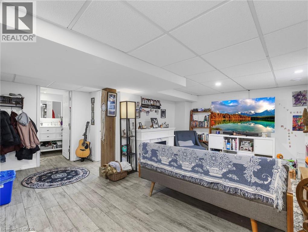 paneled ceiling and light wood-type flooring